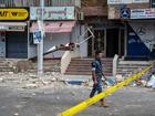 A policeman guards the scene of an Israeli airstrike on an apartment block in Beirut, Lebanon.