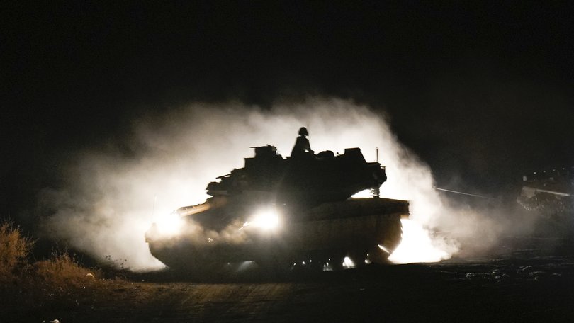 An Israeli tank manoeuvres in northern Israel near the Israel-Lebanon border.