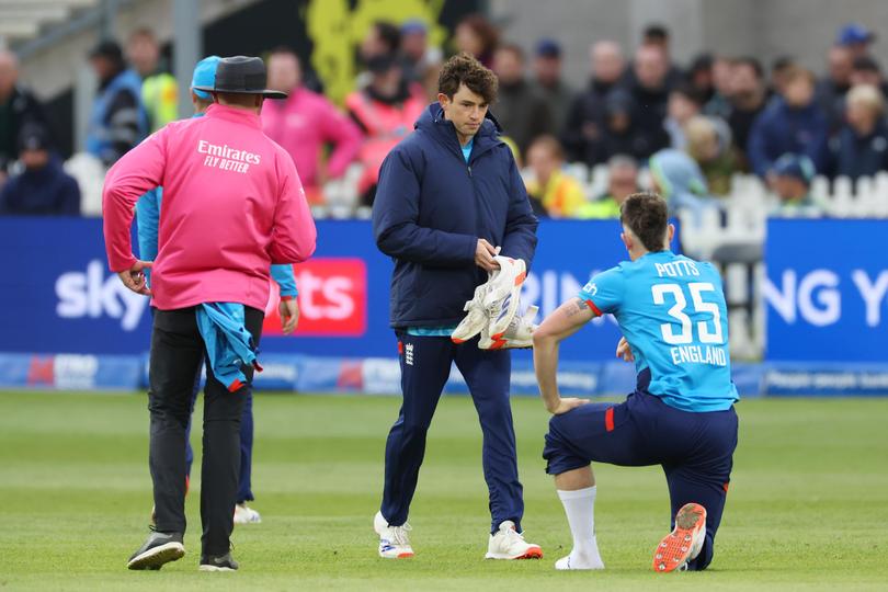  Matthew Potts changes his shoes during the 5th ODI between England and Australia,.