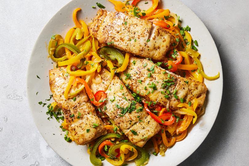 Baked fish with slow-cooked peppers.