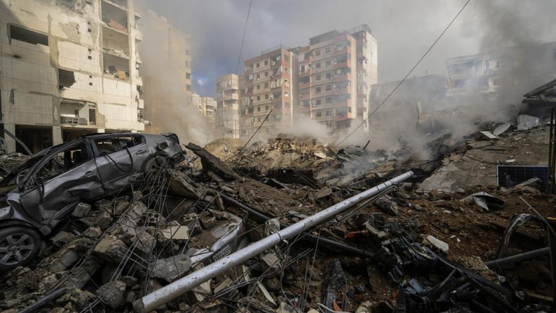 Smoke rises from the site of an Israeli airstrike in Beirut's southern suburb, Lebanon, Tuesday, Oct. 1, 2024. (AP Photo/Hassan Ammar)