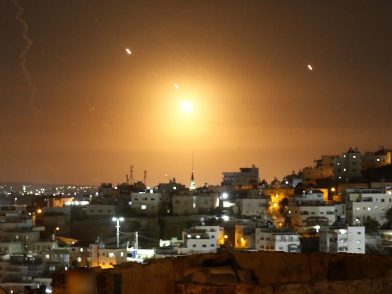 Many rockets, fired from Iran, are seen over Jerusalem from Hebron, West Bank.