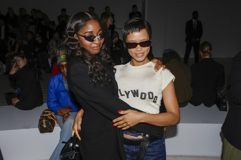 Ayo Edebiri, left, hugs Taylor Russell at the Loewe show. MUST CREDIT: Jonas Gustavsson for The Washington Post