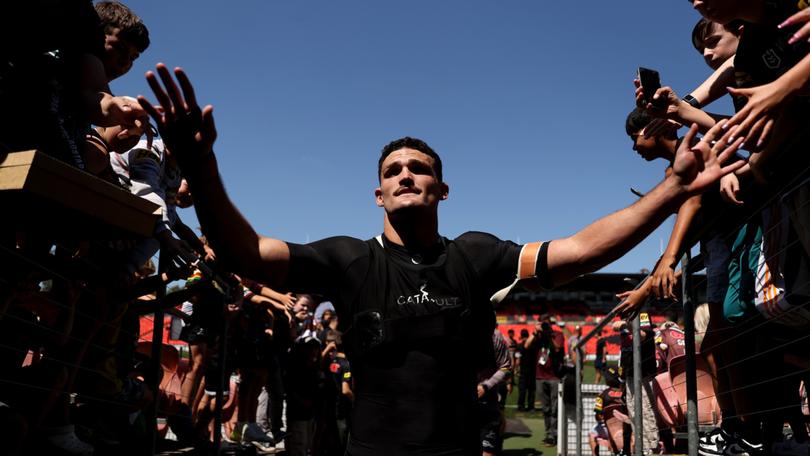 Nathan Cleary of the Panthers greets fans at a training session.