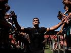 Nathan Cleary of the Panthers greets fans at a training session.