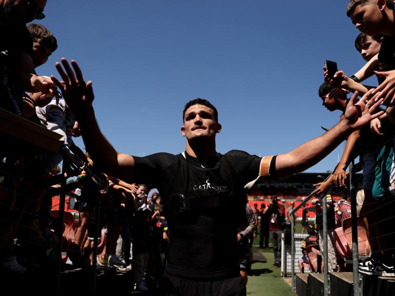 Nathan Cleary of the Panthers greets fans at a training session.