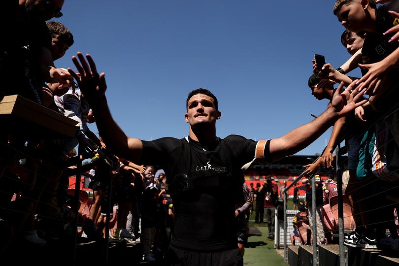 PENRITH, AUSTRALIA - OCTOBER 01: Nathan Cleary of the Panthers greets fans during a Penrith Panthers NRL training session at BlueBet Stadium on October 01, 2024 in Penrith, Australia. (Photo by Brendon Thorne/Getty Images)