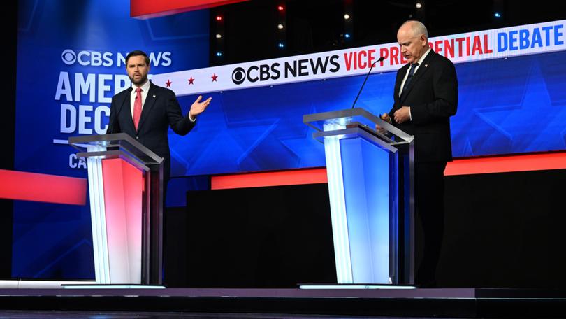 Sen. JD Vance (R-Ohio) speaks as Gov. Tim Walz of Minnesota listens during the vice-presidential debate.