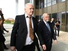 Julian Assange is joined by Kevin Rudd, Australian Ambassador to the US, outside court in Saipan. . 