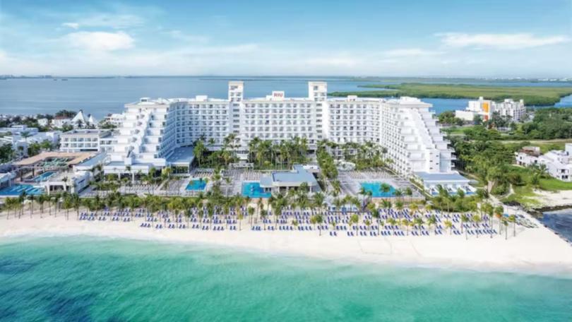 A man has been shot dead on the beach behind a luxury hotel in Cancun.