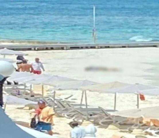 A man has been shot dead on the beach behind a luxury hotel in Cancun.