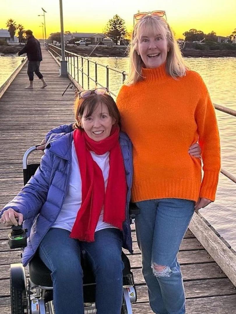 Australian TV icon Fiona McDonald, pictured with her sister Kylie, has lost her battle with MND.