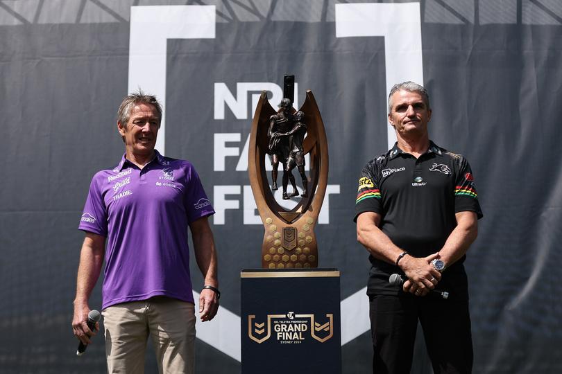 SYDNEY, AUSTRALIA - OCTOBER 03:  Craig Bellamy, coach of the Storm and Ivan Cleary, coach of the Panthers pose alongside the Provan-Summons Trophy during NRL Grand Final Fan Fest at Overseas Passenger Terminal, on October 03, 2024, in Sydney, Australia. (Photo by Brendon Thorne/Getty Images)