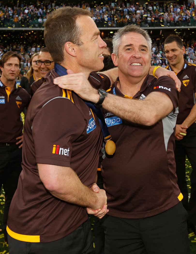 Alastair Clarkson, Senior Coach of the Hawks (left) and Chris Fagan celebrate during the 2014 Toyota AFL Grand Final match between the Sydney Swans and the Hawthorn Hawks at the MCG, Melbourne on September 27, 2014. (Photo: Michael Willson/AFL Media)