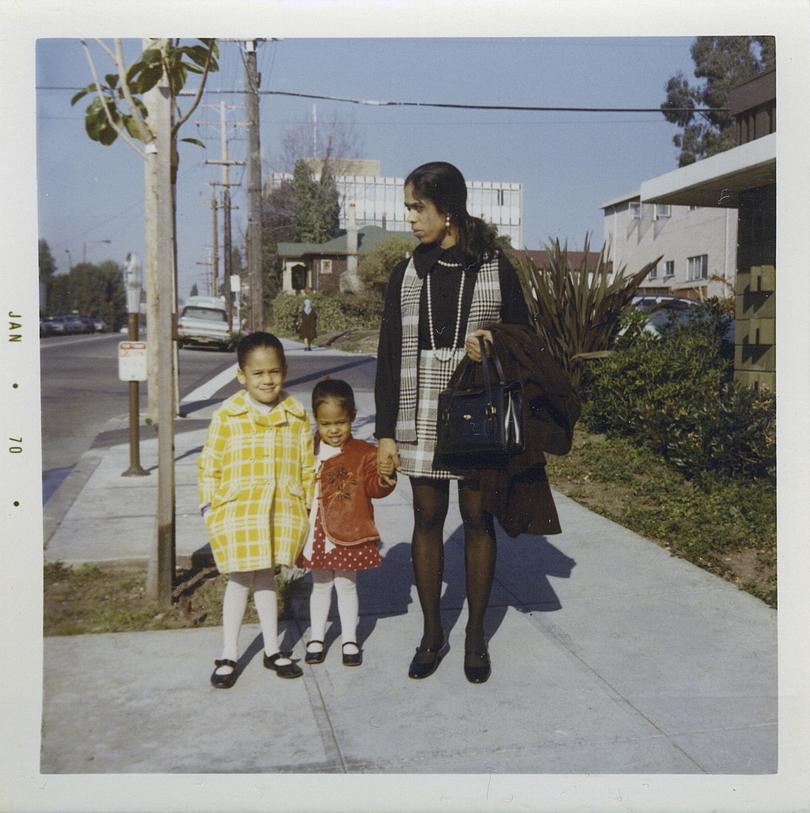 This January 1970 photo provided by the Kamala Harris campaign shows her, left, with her sister, Maya, and mother, Shyamala, outside their apartment in Berkeley, Calif., after her parents' separation. (Kamala Harris campaign via AP)