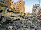 Residents run for cover following an airstrike in Beirut and, below, an Israeli helicopter fires a missile in southern Lebanon.