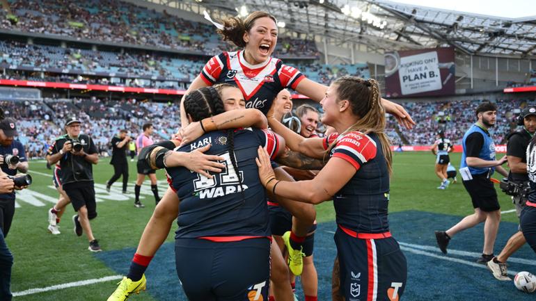 Roosters players celebrate after winning the NRLW grand final.