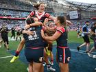 Roosters players celebrate after winning the NRLW grand final.