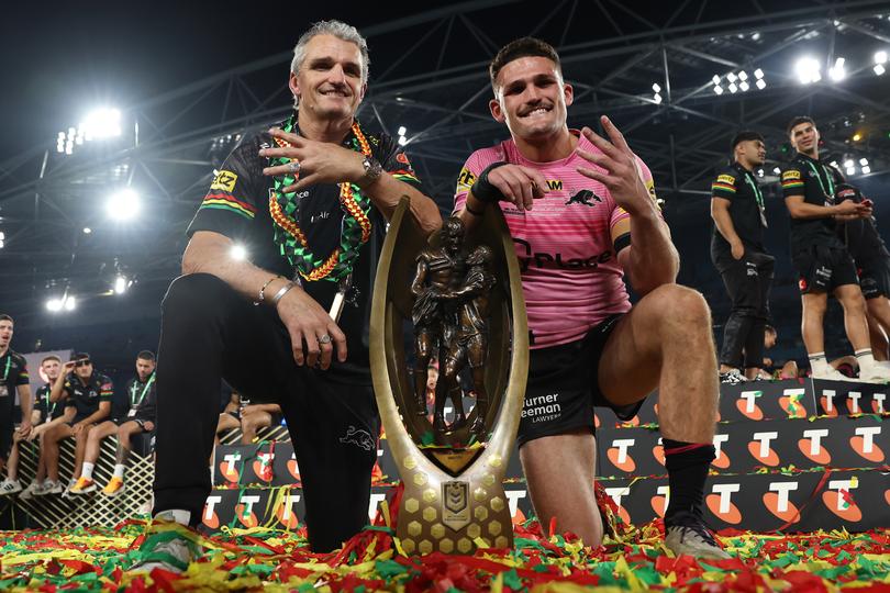 SYDNEY, AUSTRALIA - OCTOBER 06:  Nathan Cleary (R) of the Panthers poses with the Provan-Summons Trophy alongside his father and coach Ivan Cleary after winning the 2024 NRL Grand Final match between the Melbourne Storm and the Penrith Panthers at Accor Stadium on October 06, 2024, in Sydney, Australia. (Photo by Cameron Spencer/Getty Images)