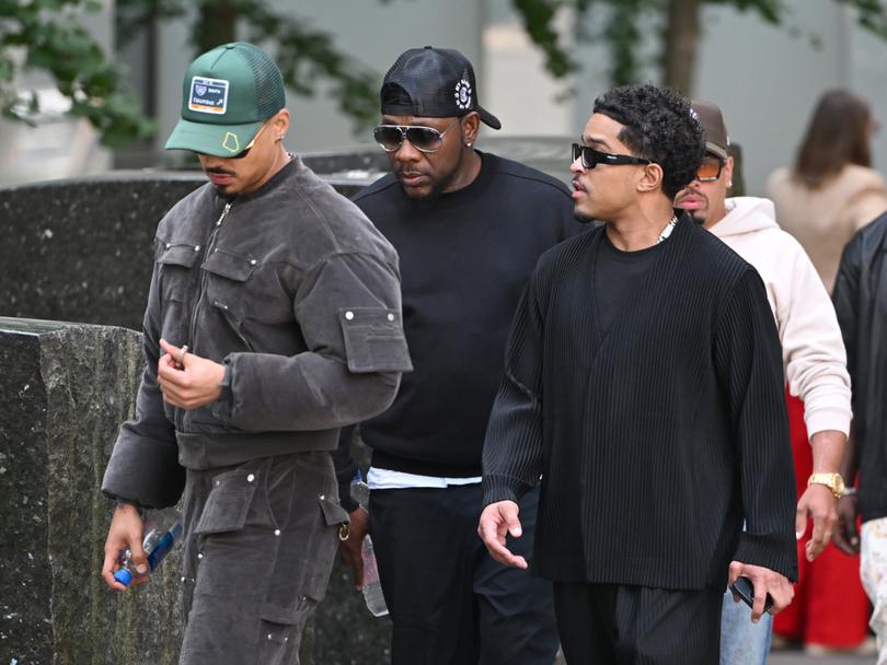 Justin Combs (r) and Quincy Combs (greet hat), sons of Sean Combs, arrive at U.S. District Court New York.