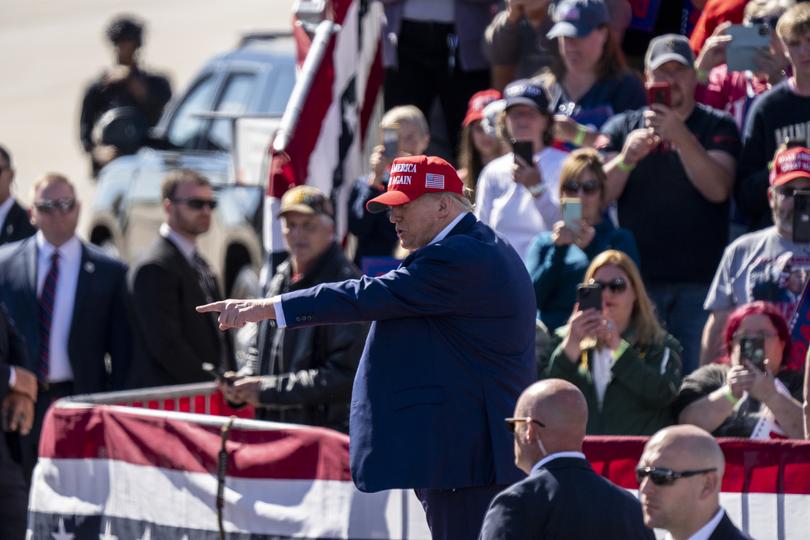 Former president Donald Trump points at a rally in Wisconsin.