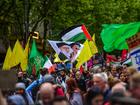 A flag with Ali Khamenei and Ali al-Sistani together with plain yellow flags replacing flags of Hezbollah are seen during the latest pro-Palestinian protest on the streets of Melbourne.