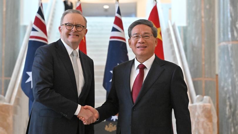 Chinese Premier Li Qiang shake hands with Australia's Prime Minister Anthony Albanese.