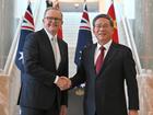 Chinese Premier Li Qiang shake hands with Australia's Prime Minister Anthony Albanese.