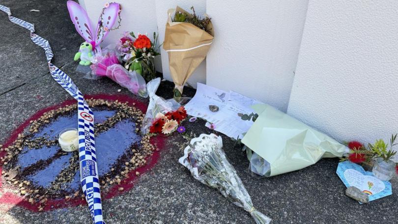 Flowers, cards and toys were left outside the Thorneside home where a girl and her babysitter died.