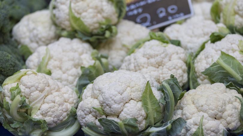 A shopper has been left needing hospital treatment after being hit in the head by a falling cauliflower. 