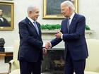 Joe Biden shakes hands with Benjamin Netanyahu.