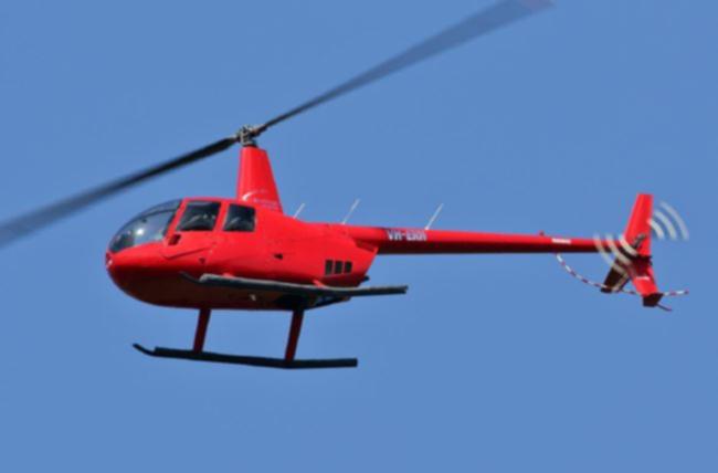 The Robinson R44 helicopter that crashed into a Cairns hotel roof.