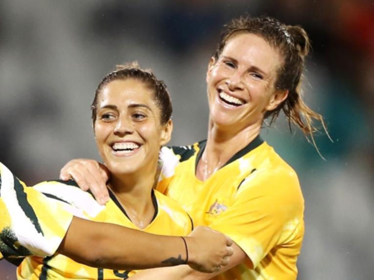 Elise Kellond-Knight (right) retires from professional football as a Australian great.