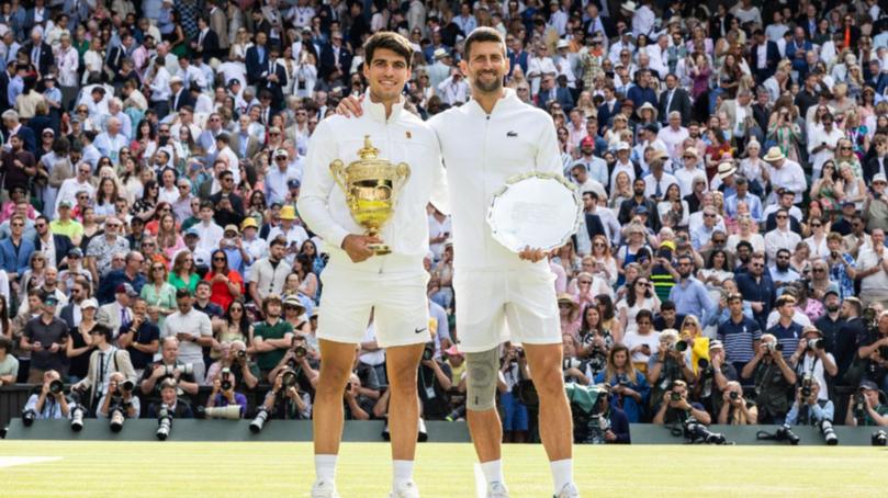 Carlos Alcaraz and Novak Djokovic pose after the 2024 final. 