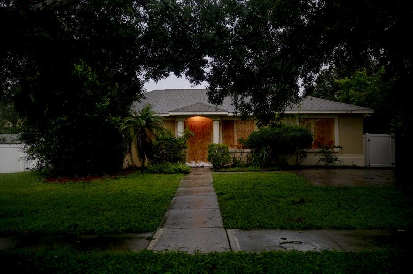 A home boarded up in preparation for Hurricane Milton in Tampa.