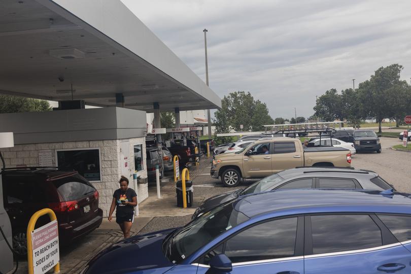 Cars line up to fill up gas in preparation for Hurricane Milton in Cape Coral.