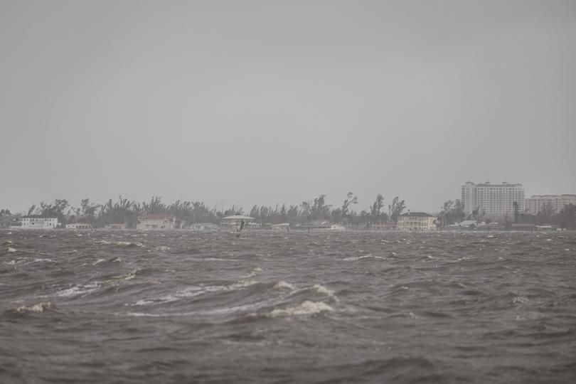 High winds and rocky waters from Hurricane Milton hit Yacht Club Beach in Cape Coral.