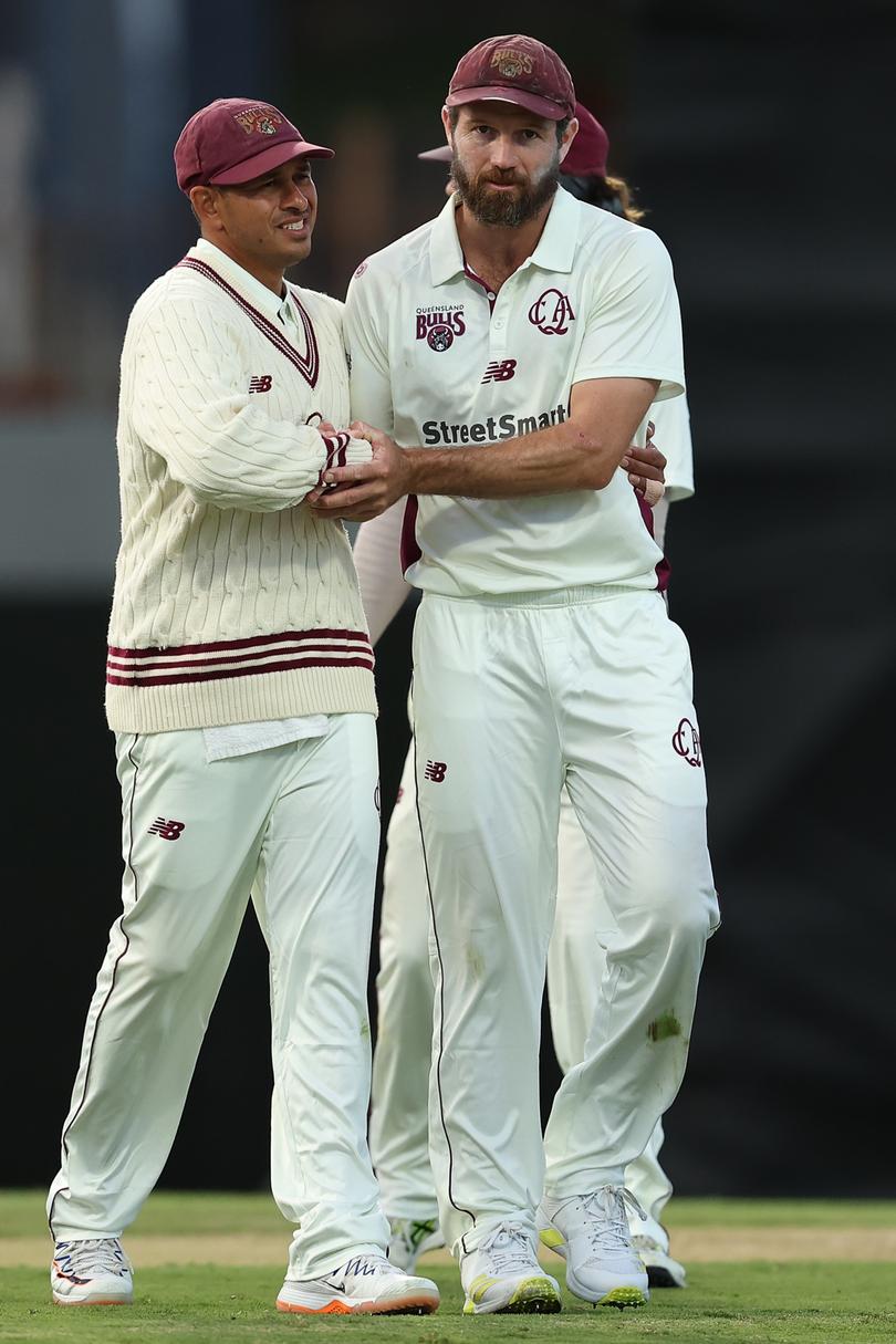 Usman Khawaja of Queensland acknowledges Michael Neser.