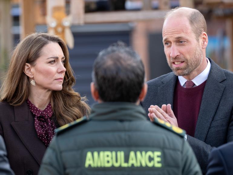 The Prince and Princess of Wales speaks with a paramedic during a visit to Southport Community Centre.