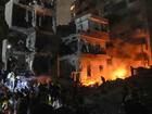 People gather in front of destroyed buildings hit by an Israeli airstrike in central Beirut, Lebanon, Thursday, Oct. 10, 2024. (AP Photo/Bilal Hussein)