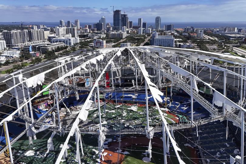 The roof of the Tropicana Field is damaged the morning after Hurricane Milton hit the region, Thursday, Oct. 10, 2024, in St. Petersburg, Fla. (AP Photo/Mike Carlson)