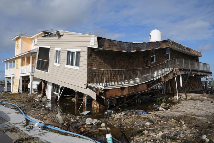 Houses lie in ruins after sustaining tornado and flood damage from Hurricane Milton.