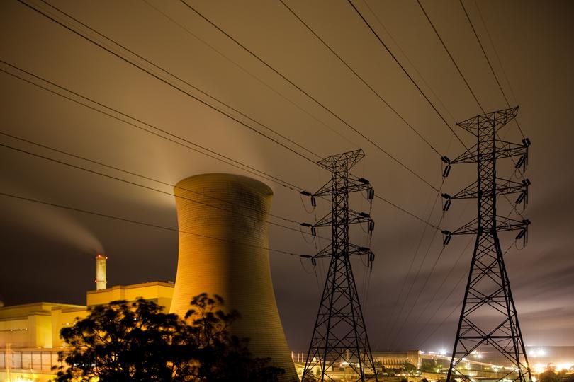 Australia, Victoria, Yallourn, Time exposure of Tru Energy coal-fired power station and high tension lines at night