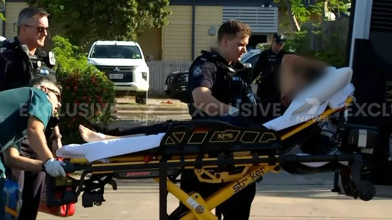 A 34-year-old woman is fighting for life after her arm was severed below the elbow in a dog attack in Toowoomba.