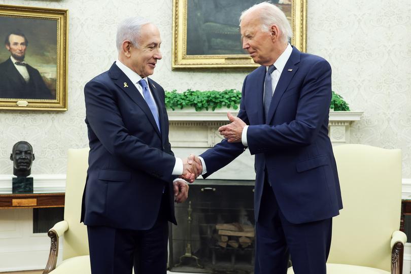 US President Joe Biden shakes hands with Israel Prime Minister Benjamin Netanyahu. 