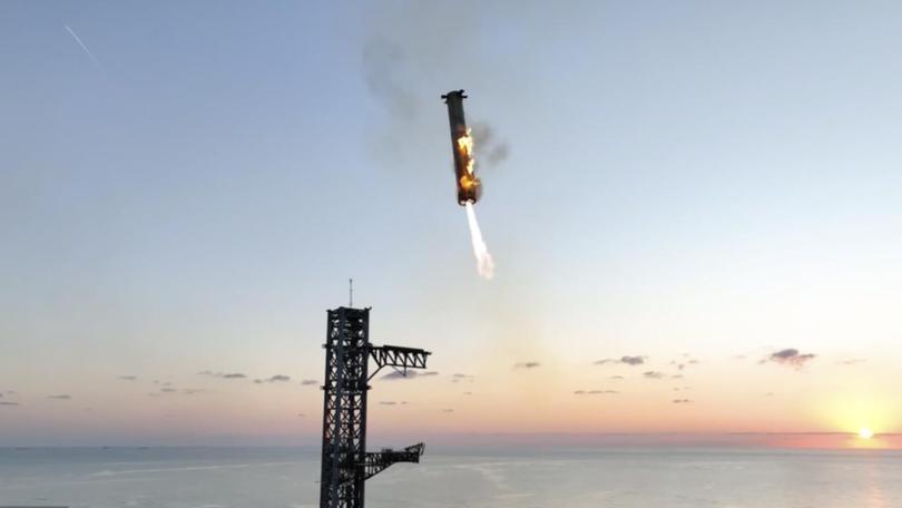 Elon Musk's SpaceX has successfully 'caught' a rocket booster used for a test flight. (AP PHOTO)