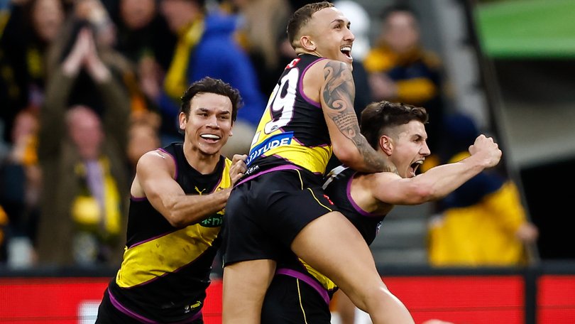 Liam Baker celebrates a match-winning goal with teammates Shai Bolton and Daniel Rioli last year.