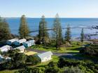 A man has died at Brooms Head in NSW after he was washed off rocks. File image