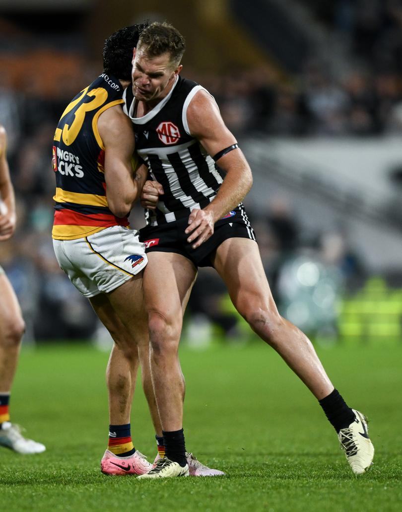 ADELAIDE, AUSTRALIA - AUGUST 17:   Izak Rankine of the Crows is knocked out by  a late hit from  Dan Houston of the Power during the round 23 AFL match between Port Adelaide Power and Adelaide Crows at Adelaide Oval, on August 17, 2024, in Adelaide, Australia. (Photo by Mark Brake/Getty Images)