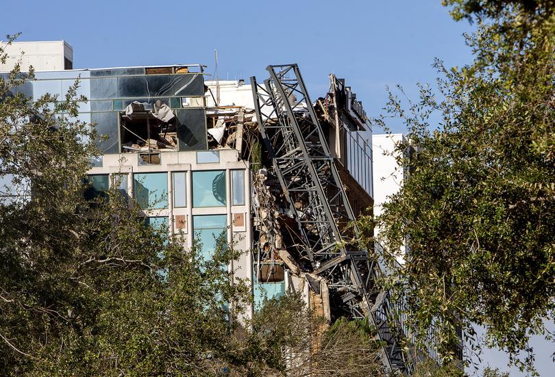 A crane that fell into a building during Hurricane Milton in St. Petersburg. 